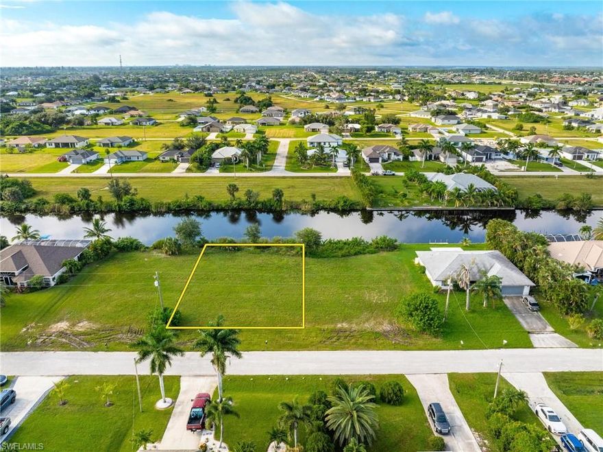 Build Your Dream Home on this Stunning SOUTHERN EXPOSURE WATERFRONT LOT – perfectly Cleared with minimal vegetation, offering Endless Possibilities! This UNIQUE OPPERTUNITY includes the Potential to Purchase the ADJACENT LOT (MLS# 224075570) to create a Larger Estate, add an RV Garage, ample Boat Storage, or Design your Private Oasis complete with a Pool Overlooking the Water, where you can enjoy Breathtaking SWFL SUNSETS!

These Lots boast Over 10 Miles of Freshwater Canals, ideal for Boating, Fishing, and Kayaking. Enjoy the serene lifestyle of Walking and Biking in this peaceful community or take a short drive over to the local CORAL OAKS GOLF COURSE! Nestled in a quiet, friendly neighborhood with New Construction Homes, this Prime Location is conveniently Close to Local Amenities such as the Northwest Regional Library, Grocery Stores, Gas Stations, and Schools like Mariner Middle and Mariner High, all just a short distance away.

With Easy Access to Pine Island Rd, Burnt Store Rd, and nearby Punta Gorda, you're Minutes from Dining, Shopping, and Entertainment. Additionally, the Charming Waterfront Community of MATLACHA is just a few minutes away, offering unique Dining and Shopping Experiences.

This Location is NOT currently planned for City Water and Sewer, and NO Assessments are due! The Lot is affordably priced with its Unique Opportunity compared to other city locations. Don’t miss this chance to secure your Piece of Paradise and Live where others Vacation!
