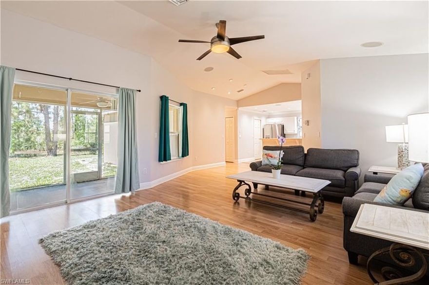 Here's your chance to own a home in the fastest growing part of Naples with NO HOA FEES!  This 3 Bdrm/ 2 Bath  home has been lovingly maintained by it's original owners and offers an OPEN FLOOR PLAN, upgraded vinyl tile throughout, upgraded tile flooring in baths, freshly painted, 2 Car Garage, Tankless Water Heater, and Water Softening system. Nestled on 1.14 acres of peaceful land, yet minutes from Publix and CVS, you are greeted by a long driveway with plenty of parking and plenty of room in the back to add a pool, outbuilding, horses, etc.  SO come see this beautiful home surrounded by nature in a booming area because this property is more than a just a house, it's a BIG open canvas that will allow you create a place to truly call home.