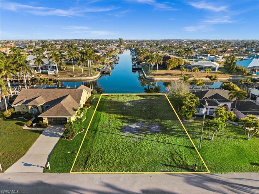 RARE INTERSECTING CANAL GULF ACCESS LOT WITH A NEW SEAWALL — READY FOR YOUR DREAM BUILD! Welcome to 2623 SW 35th Ln, a prime build site in one of SW Cape Coral’s most desirable boating neighborhoods, just off Surfside & Oasis, surrounded by beautiful waterfront homes.

Enjoy long canal views in multiple directions and the true Southwest Florida lifestyle. Keep your boat in your backyard and cruise the Cape Coral canal system out to the river and Gulf for fishing, island days, and waterfront dining.

Big bonus: the hard work is already underway. A seawall was installed in 2023, and the seller has completed a substantial amount of pre-construction planning—including approved plans and permits that have been pulled and paid for (construction has not begun). The seller has invested in architectural/structural plans, surveys, site and drainage plans, energy calculations, and more. Plus paid permit fees and a truss deposit.

Build your dream Gulf access home now, or secure a high-demand waterfront lot as an investment for the future. Buyer to verify all building requirements, permit status, and transferability with the City of Cape Coral.