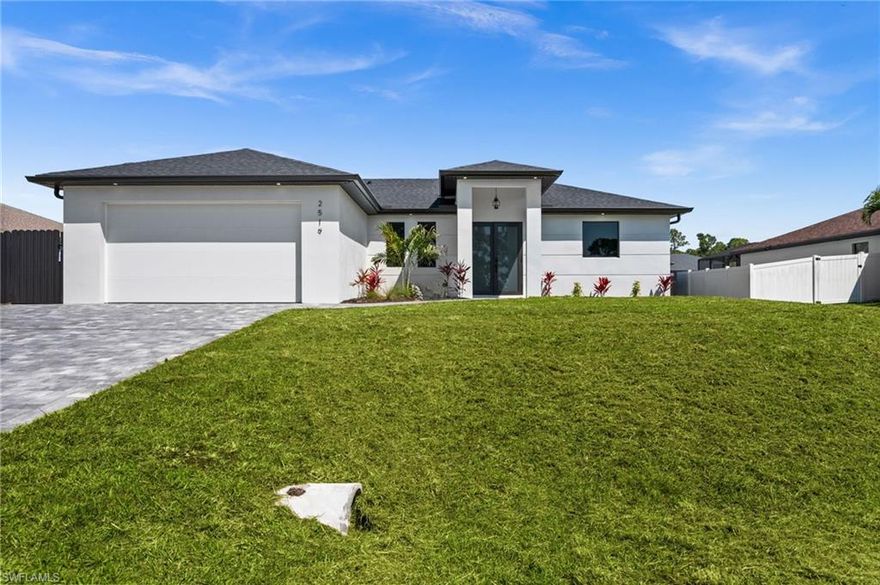 Welcome to the "Moonstone" Model. This amazing home is the perfect blend of value, comfort, luxury, style, and security. This beautiful new construction is built for everyone who wants to live with all the comforts of 'home.’ Impact windows and doors, European style kitchen featuring soft closing cabinet doors, drawers and Bloom hardware, high-end appliances, double oven, hood, cooktop, wine cooler, and much more. Master bedroom with custom designed built in walk-in closet, master en-suite with glass shower enclosure, double vanity, and linen closet. Two spacious bedrooms with walk-in closets, guest bathroom with glass shower enclosure. Home offers open concept layout with 10-foot-high interior ceilings, 8-foot-high designer doors. Outdoor kitchen with marble countertops and 1/2 bath by the pool, ready for enjoyment 12' x 24' beautiful pool with Sun Ledge, 2 car garage, washer, dryer, and laundry sink. "NO FLOOD INSURANCE NEEDED". Engulf in the multitude of upscale details that you must see to appreciate. Enjoy your day by the pool or explore everything Cape Coral has to offer. Do not miss out on this one-of-a-kind opportunity! Schedule your showing today and make this beauty your home!