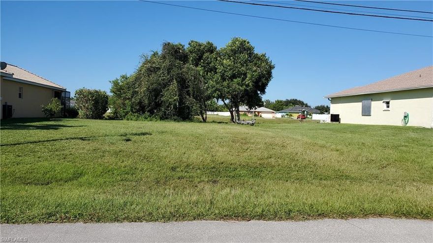 Level, Buildable waterfront lot in the Heart of Cape Coral. This established neighborhood is close to everything that the Mid-Cape has to offer.