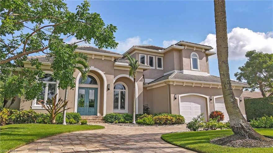 This beautifully appointed 2017 home in Royal Harbor is as grand as it is inviting!  The open floor plan incorporates one of neighborhoods nicest wide-water views. 5 bedrooms and 4 baths include a gracious foyer entry with custom finishes, first floor master, home office, living, dining room and breakfast area overlooking the water with surround sound, two wine refrigerators, an ice maker, huge walk-in pantry and oversized quartz island! The primary suite on the main level has two walk-in closets and an grand bath with free-standing tub, separate shower and individual vanities that make this a spectacular dressing area. Plantation shutters grace every window adding elegance to the homes' features.  The upper level has three additional bedrooms, two baths (one private to a guest room) along with a large game room/den/media room that overlooks the water. The lanai and salt water pool/spa area has surround sound, auto retracting screens and offers wide views with sun throughout the day. The custom landscaping and deck lead to the boat lift. Exquisite describes this property in every way. New dock and new boat lift.