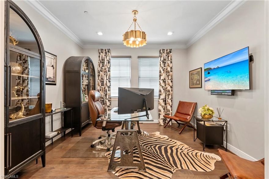 A rare opportunity to own a professionally decorated and highly upgraded Viansa Terrace Home condominium in the heart of Talis Park, one of Naples’ most desirable communities.

This exceptional home offers three generously sized ensuite bedrooms, providing comfort and privacy for residents and guests alike. An additional half bath adds convenience for entertaining. Elevator access delivers you directly to your private foyer, enhancing security and ease of entry. A spacious den provides flexibility, making it ideal for a home office or a media retreat.  Unique to this condo is a private two-stall garage, ensuring secure parking and ample storage space—a feature seldom found in condominium living. The screened loggia overlooks lush green views, creating a tranquil outdoor space that is perfect for entertaining or simply relaxing. This serene setting brings the beauty of the outdoors into your daily life.

Each room has been professionally decorated with thoughtful finishes and a sophisticated palette. Upgrades, including lighting, appliances, cabinetry, fabrics and textures, make this property truly unique.

As a resident of Talis Park, you will enjoy access to world-class amenities such as a championship golf course, restaurants, resort-style pool, modern fitness center, tennis courts, pickleball, and a vibrant social calendar. Behind the iconic gates, your haven awaits.