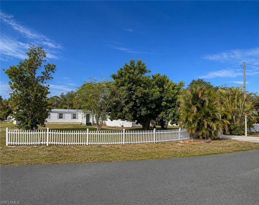 Affordable, spacious, and hard to find! Welcome to Spring Woods M/H Subdivision, where this 3-bedroom, 2-bath home offers 1,442 square feet, a metal roof, 2 year old AC system and a partially fenced corner lot of over .38 acres on a private cul-de-sac. Located in Flood Zone X 500, this property stands out for both value and peace of mind. Inside, the home features a large kitchen with abundant cabinetry, a comfortable living room, a separate family room, interior laundry with washer and dryer included. Bonus room serves as 3rd bedroom with separate entry, ideal for guests, an office, crafts, or extra storage. There is also extra paved parking and plenty of outdoor space to enjoy. The yard is spacious with mature trees, mango and poinciana are just 2 of them. With no age restrictions, no tenant restrictions, and up to two pets allowed, this home offers rare flexibility for homeowners, seasonal residents, or investors. Residents of Spring Woods enjoy low HOA fees of only $117 per month, including the clubhouse, community pool and picnic area, lake, and RV/boat storage. RV/boat storage alone are worth the low fee. Convenient to shopping, schools, major roads, and I-75, this is a terrific opportunity to own an affordable home with room to spread out in North Fort Myers.