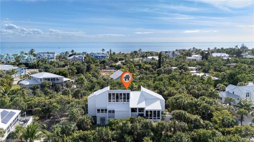 Right out of Architectural Digest, this is the only residence on Sanibel Island designed by renowned architect Bruce Gora.Every photograph captures the home using solely the abundant natural light that fills its spaces. Meticulously built and recentlytransformed with countless upgrades, this home boasts an array of luxurious details. Highlights include a stunning gourmet kitchen outfittedwith brushed leather granite countertops, custom Thomas Mix cabinetry, premium GE Profile appliances, a Cafe' Smart induction cooktop,and rich hickory and bamboo flooring. The addition of a resort-style heated pool creates and outdoor oasis tailored for the ultimaterelaxation. Multi-level balconies offer seamless connections to breathtaking water views, evoking the sensation of being on a luxury cruiseship. For boating enthusiasts, step out to your private dock--perfect for a day of fishing or watching a spectacular Sanibel sunset. Just onehome away lies a private deeded boardwalk leading directly to the powdery white-sand beaches that earn Sanibel its reputation as theshelling capital of the world. Enjoy the tranquility of the quiet East End, with convenient access on and off the island, plus and easy walk tonearby shops and restaurants.