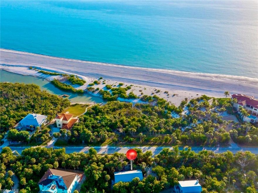 This is easy island living done right! Located on the West End of Sanibel Island along the edge of the Santiva neighborhood, this elevated two-bedroom, two-bath home sits on a private half-acre lot just steps from Blind Pass Beach, with the infamous Sanibel shared-use path right out front and quick access to both Captiva and Sanibel town centers. Best of all, the only land between you and the beach is a protected strip of SCCF conservation property—keeping your walk to the Gulf open, natural, and untouched. Enjoy the morning Gulf breeze with your coffee and wind down in the evening to the peaceful sound of waves lapping the shoreline. Inside, the home offers a relaxed coastal-casual design with high ceilings, luxury vinyl flooring, and bright, open living spaces that are comfortable and low-maintenance. The primary suite features a private bath and back patio, while the guest bedroom and bath are perfectly suited for guests and visitors. Outside, enjoy tropical views from the screened lanai or take advantage of the reimagined covered downstairs space—complete with new electrical and epoxy floors—ideal for entertaining or everyday island living. Sold fully furnished and loaded with recent upgrades including impact windows and doors, a new AC system with ductwork, LVP flooring throughout, and so much more-- all with the benefit of ample room for the home to grow on its oversized private lot. Walk, bike, beach, repeat—this is low-stress, high-reward island-time living!