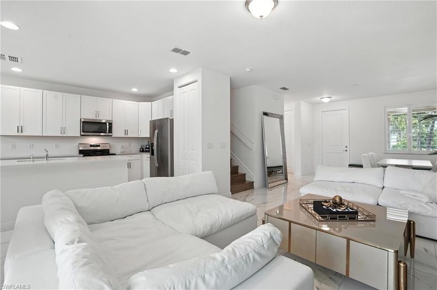 Experience modern elegance in this beautifully upgraded 3-bedroom, 2.5-bathroom home offering 1,753 sq. ft. of thoughtfully designed living space and a 1-car garage. Meticulously maintained and hardly lived in, this residence feels like new and showcases true pride of ownership. From the moment you step inside, you're welcomed by custom white tile flooring, sleek quartz countertops, and stainless steel appliances that create a clean, refined aesthetic. The open-concept layout seamlessly connects the main living areas, ideal for both everyday living and entertaining. Upstairs, rich engineered hardwood flooring runs throughout, adding warmth and sophistication to the private living spaces. Every detail has been carefully curated to offer both style and comfort. Perfectly positioned in an incredible location just minutes from the beach, dining, and shopping, this home delivers the best of modern living and coastal convenience. Located in a vibrant and amenity-rich community, residents enjoy access to a Gordon Lewis-designed 18-hole public golf course, clubhouse, resort-style pool and spa, on-site restaurant, pickleball courts, and a well-equipped fitness center.