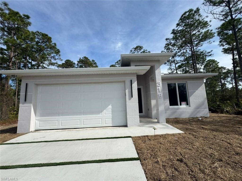 Photo of 319 Lorena AVE S, LEHIGH ACRES, FL 33974 (MLS # 226016988)