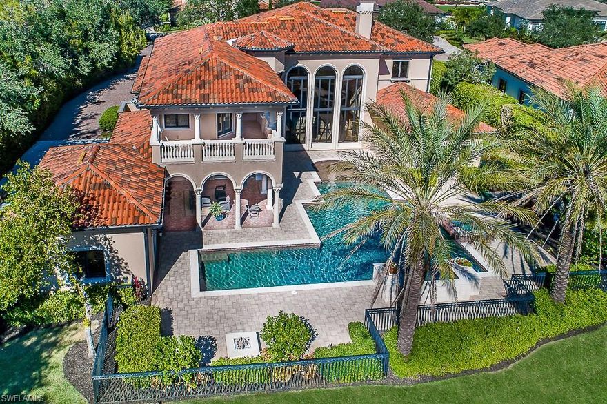 Extraordinary Prato Grand Estate in the renowned community of Talis Park. Luxurious finishes & fine craftsmanship can be found is this newly remodeled extravagant 7167 SF two-story home with convenient private elevator. Home sits on a premium 1/2 acre beautifully landscaped lot with the best views of the lake & golf course. Your choice of 1st or 2nd floor master bedroom suites, one with pool access & the other with stunning views from a private balcony. This home is for someone who wants the very best. Soundly built with impact windows & doors, 5 zone HVAC, gas stove, climate controlled wine room, Lutron home automation, custom closets, 3,000 sf pool & spa area, covered lanai, outdoor kitchen & dining area, new gas grill & fire pit. Fill this home with your special guests–6 BR's, 7.1 BA's, 5 car garage, media room, loft, private cabana guest room suite, 3 washers & dryers, 3 dishwashers. 18-hole private golf course designed by Greg Norman & Pete Dye.