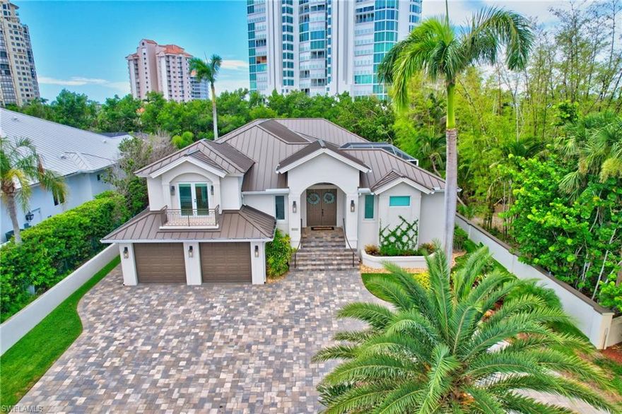 H10452 5141 Seahorse Ave is a well maintained custom waterfront home, west facing, in a prime location with easy access to all that Naples has to offer! Gulf Access within 10 minutes from the private dock, walking distance to the beach & gorgeous sunsets, Seagate Beach Club, Clam Pass, fabulous restaurants, Waterside Shops, Venetian Village, Artis Naples, Mercato & more, this home offers so much being in the heart of Seagate! Seagate is a lovely beach and boating community with only 90 homes that boasts a private club with gated access to the beach pavilion, parking, bathrooms, and grills. The home includes a new roof, new HVAC, new water heaters, and high elevation! The split floor plan uniquely features a bonus and separate guest suite with its own kitchenette and ensuite bathroom, and separate storage room for your use. Continuing into the main part of the home, there are 4 large ensuite bedrooms, including a front facing bedroom or flex room with a nice Juliette balcony. The natural light throughout creates a serene and peaceful atmosphere alongside the high ceilings and open concept space. Enjoy life in Naples with the sunset each night & surrounded by beauty! H10452