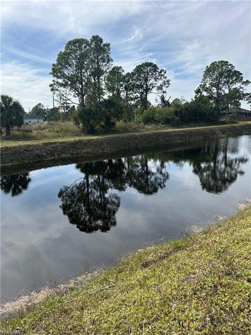 Opportunity Knocks!
Don’t miss this rare chance to own side-by-side canal-front lots with desirable southern exposure. The adjacent eastern lot (MLS #2025025130) is also available, offering the flexibility to build two separate homes on a wide canal or combine both parcels into one impressive half-acre homesite.

Located just north of State Road 82, these lots sit in a quiet, established neighborhood while still offering quick access to major roads, shopping, and amenities. Electric is available at the curb, making this an attractive option for builders, investors, or buyers planning future construction. 
Low taxes, local sellers, and quick responses with fast closings make this an easy decision.
Not an assignment of contract.
Buy now and build in this peaceful yet conveniently located area!