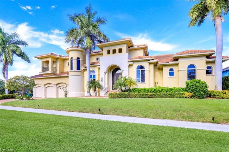 Cash flow in this palatial waterfront Villa with long water views. Graceful arches and ornate columns adorn the exterior and interior, highlighting the grand scale of the rooms and vastness of the home. A two-story foyer welcomes you to an open plan formal living room and dining area. A full-service wet bar opens to the family room and dine-in kitchen with center island, breakfast bar, walk-in pantry and storage. The stylish tile flooring, fixtures, finishes and high ceilings add to the luxury villa vibe; while large arched windows bring in abundant light. One primary ensuite bedroom is on ground floor with guest suite split on other side. A statement staircase leads to the upper-level games room. 2 of the 3 upper bedrooms are en-suite and share the wrap around balcony lanai. All 6 bathrooms are charming, spacious and beautifully appointed. Features a 3-car garage and 4 driveway spaces. Enjoy the waterfront in-ground pool, raised spa, lounging area and multiple dining areas with canal and long water views, sea life, and boats. Live large in this home, hosting family and friends in style or extend to visitors for rental income. This home is offered with rentals in place.