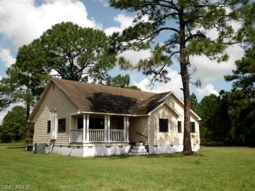 Need an acre, with a home & a barn?  We have it!  Located E of LaBelle this home was built in 1993 and offers 3 bedrooms, 2 baths, an eat in kitchen, formal dining room, interior laundry, large family room, and over 1700 sq. ft. of living space.  Enjoy the covered porches, fenced yard quiet country living.  Just minutes from Clewiston with easy access to County Rd 833 and State Route 80.  Make your appointment today.