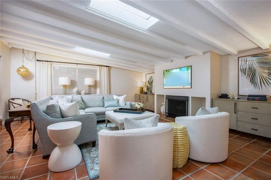 This charming Old Naples house has a perfect combination of great location, serene outdoor spaces, and a spacious, updated interior. The house is 2.5 blocks to the beach, a short bike ride to 5th Ave. S., as a well as the local grocery so leaving the car in the three - car garage is optional. Magnificent outdoor spaces make this home a private oasis. Spend the day by the open- air, resort style pool with lounge chairs, umbrellas, and the sound of palm fronds rustling in the wind. For reading, relaxing, or entertaining friends and family, this property boasts both a lanai and a courtyard. The lanai has a large dining area and sitting area. The courtyard is a unique walled and screened space that provides privacy and another area for entertaining. It combines indoor comforts with fresh air and sunshine or evening stars. The interior has been updated with upscale furnishings throughout an open floor plan. The kitchen was recently renovated with all new white shaker cabinets with quartz countertops in the heart of the home. This three- bedroom, three bath home has a large master suite with cozy seating area walk in closet and large bath with soaking tub and walk in shower.