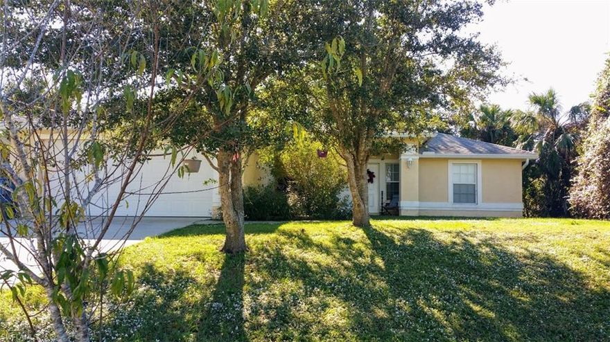 A solid concrete block construction (unlike a lot of the new construction), three bedroom, two bath home,  that has been updated, with wood-like tile flooring in the living areas, a open floor plan, large master bath with dual closets and sinks, private guest room area, indoor laundry room, a large screened lanai under truss, and much more. Outside the back yard is chain link fenced and backs up to a greenbelt area, there are fruit trees, and mature oaks. Within biking / walking distance to the LaBelle Middle School and High School, this is just a good, family friendly home!