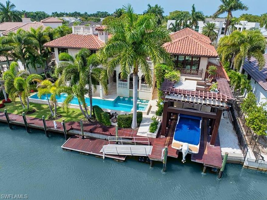 GORGEOUS! One of a kind! 
Perfect for boaters, the home is bridge free to the Gulf of Mexico. There are many outdoor spaces this home has to offer . Swim laps in the 60 foot, 8 foot deep, electric and gas heated salt water pool. 10 minute walk to the Gulf. 3rd level terrace with views of the Bay to the east and sunset to the west. Unparalleled beauty defined in this Asian-Italian inspired courtyard home. Upon entering through an iron gate you are greeted by a flowing water koi pond, exquisite Marmorino venetian plaster walls on the interior and exterior, Luxbaum (hurricane proof) windows, stone and rosewood floors throughout highlighted by blooming bougainvillea views. Ample space for relaxation and entertaining in the large great room dining kitchen area, 5 bedrooms, 5 full baths, and 2 half baths. The second-floor holds an additional family room with bar and kitchen area perfect for getting away when the family is visiting. The master bedroom has a private sun terrace, a walk-in closet, a large bathroom with dual marble sinks, soaking tub and steam shower. Move-in ready, being offered furnished. Minutes to 3rd Avenue shopping and dining. This home was designed by Tom Pitchard of Matterlake Designs in NYC and built by Garcia Builders . First floor living space significantly elevated. Elevation certificate is available - contact listing agent.