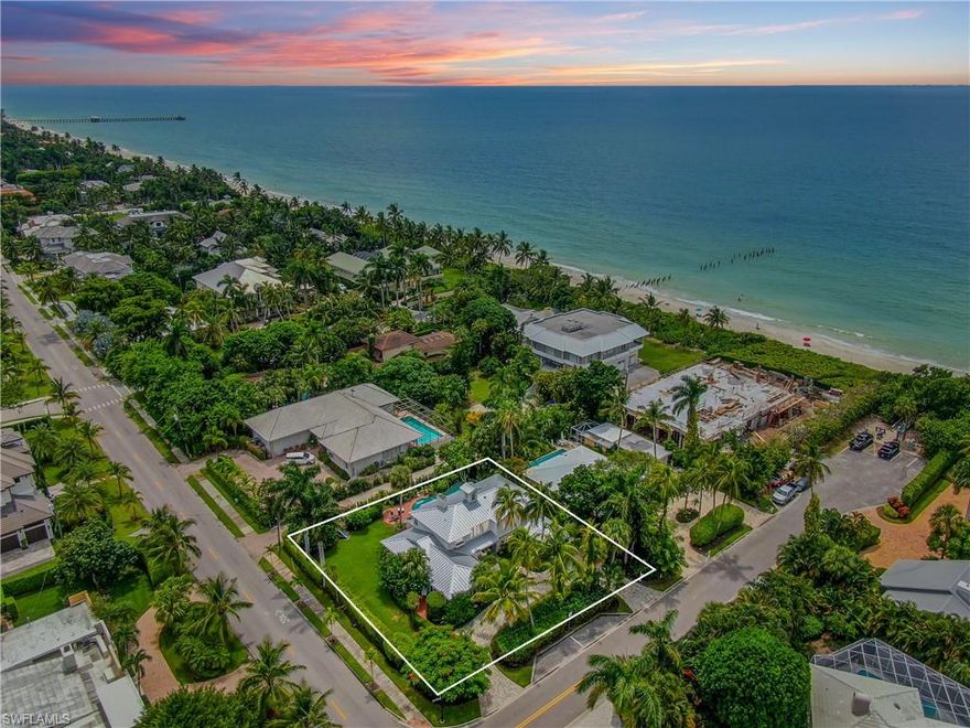 This enchanting Old Naples residence located in the beach block is just steps from the renowned sugar sand beaches that make Naples famous. Masterfully restored with modern conveniences with design work done by MHK, the home offers over 4,300 sq. ft. of indoor and outdoor living spaces.  This timeless Old Florida style residence with southern exposure, an attached guest suite, pool, and spa, and is surrounded by tropical landscaping. Characterized by extensive millwork throughout, an open floor plan, gourmet kitchen with island, double-sided lower level fireplace, multiple seating areas, and french doors invite the outside in for true Florida living. A master retreat with fireplace, steam shower, and freestanding soaking tub is joined by two additional guest bedrooms,  a den (currently utilized as a 5th bedroom) with an attached en-suite bath, and a laundry. The home has an adjoining first-floor guest suite with full kitchen, living area, bedroom, and bathroom. This property is in the perfect location for the buyer who seeks beach block living and the convenience of being in close proximity to the renowned 5th Avenue South, and the many attractions of downtown Naples. A Must See!