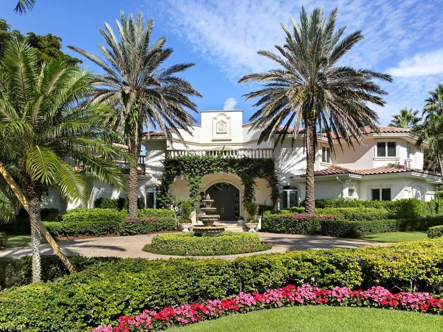 H.13891 - Click Video. Refreshed inside and out, this majestic corner property features an elegant paved circular driveway, a 4-Tier Fountain and two Imperial Medjool Date Palm trees, all framing its Stately Entrance. Once inside you are captivated by a Grand Interior of opulent finishes, a towering ceiling, spectacular chandeliers and custom workmanship. Its adaptable classic interior architecture allows you to effortlessly showcase a modern decor and new color palette as well. Carved double doors lead to a huge open Family room, gourmet Kitchen and Morning room. The expansive Master Suite includes a Study, Den, Kitchenette and Walk-in Closets. A stunning expansive Balcony overlooks a resort-style Pool, Spa and Deck area with sprawling lounging and dining spaces and an exquisite Lake View. Guests can select from four well-appointed bedrooms on the main floor or relax in the Loft Apartment. This exceptional residence is located in the upscale community of Bay Colony in Pelican Bay. With private beach access, attended service and a fabulously renovated Beach Club it defines Naples' superb lifestyle.