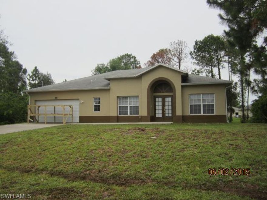 CHECK lot size. Rare 1/2 acre in SW section of Lehigh. Popular location, very close to Buckingham Road with easy access to Ft Myers and I75. Well maintained home. Over 2000 square feet of living area. Carpet and tile floor coverings. Kitchen has granite counters, a great island and custom back splash. Large family room, formal living and dining, with a sweeping interior entryway. Breezy lanai and a large open patio for grilling or a hot tub.