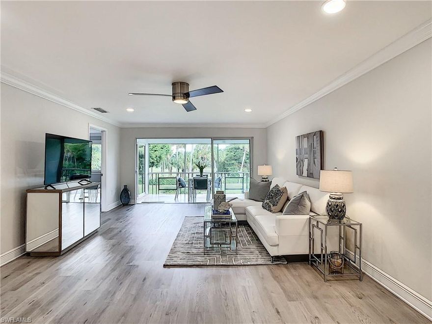 Step inside and your first view is the LaPlaya golf course through the waving palm trees. Enjoy a peaceful beverage on the screened lanai overlooking the lush lawn, golf course and the pool. This open plan 2 bedroom, 2 bath, 2nd floor condo has been tastefully and meticulously updated. From the new luxury vinyl plank floor to the crown molding and smooth ceilings above. The kitchen has stainless steel appliances, granite counters, a tile backsplash and lots of storage with pull out drawers in the pantry. The master suite has sliding glass doors to the lanai and has an updated bath with granite counters and dual vanities, gorgeous custom tile in the shower and a walk-in closet. New AC, upgraded ceiling fans and lighting, new faucets, no detail has been overlooked. There is also a storage locker for your bikes and beach chairs. Located just 4 short miles to the beach and centrally located to enjoy dining and shopping, just 20 miles to the airport. Only 3 units in the building make this a quiet and serene home. Montego Manor is an intimate community of 35 homes located in the desirable Palm River neighborhood in North Naples. This is your perfect winter getaway or full time residence.