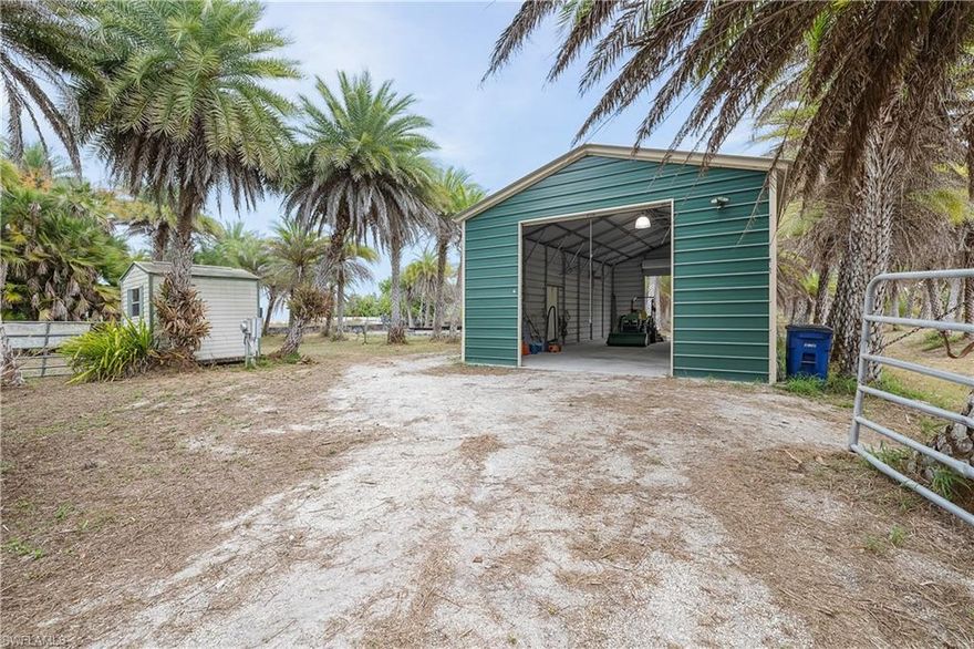 This is a beautiful property located in Bokeelia. With approximately 250 Sylvester palms.
  There is a 22 X 40 ft metal building with on an 8.6" concrete slab. The building has two 10' X 12' roll up doors,  that is hurricane rated.
Also on the property is a 5.5' X 8' storage building.  Fenced with 2 large entrance gates on the main access road.
Feels rural but you are close to boat ramps, restaurants, and all that Pine Island has to offer.