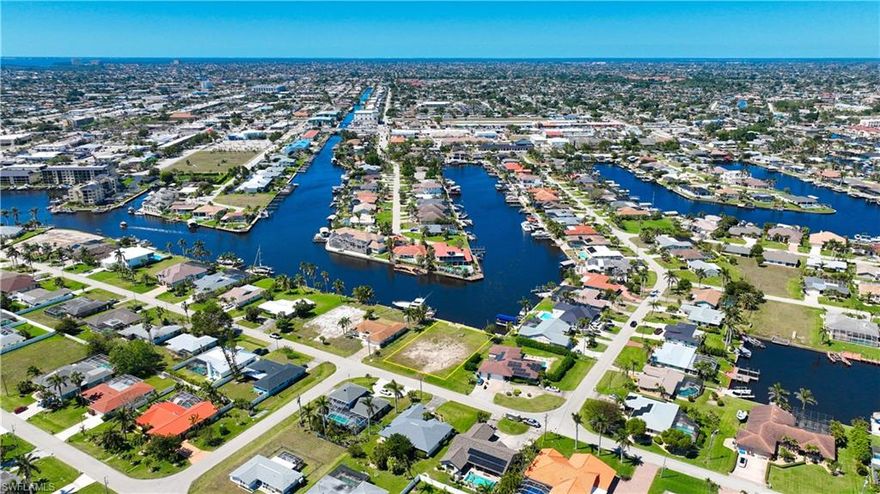 Attention Boaters: This is the one you have been waiting for! One of the largest direct gulf access lots in Cape Coral! No bridges and only 5 mins to the Caloosahatchee River. More than 19,000 sq ft of western exposure on the more than 200 ft wide Mandolin Canal with a view of more than 450 ft into the intersecting Marlboro Canal. The previous home got demolished and the lot is ready for your new construction project. Seawall in, all Assessments paid and save on impact fees. This lot is perfect to enjoy the popular sunsets of Southwest Florida. Very close to downtown and the expanding entertainment district, quick access to the South Bridge.