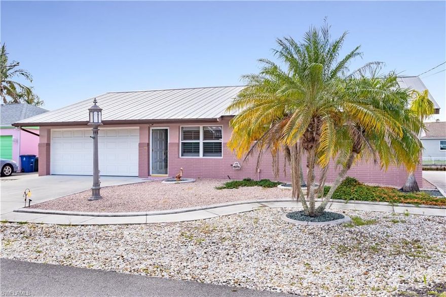 WATERFRONT **DIRECT ACCESS** ISLAND LIVING!   Imagine yourself driving onto this small island oasis…turning onto the cul-de-sac street with waterfront homes on both sides…walking into this FURNISHED/TURNKEY home… and you are home!  BRAND NEW SEAWALL installed this year!  Two HUGE sunrooms/enclosed lanai areas…one located right off the master bedroom.  Stunning walls of sliders with gorgeous VIEWS OF THE WATER make this home light and bright!  Easy maintenance required on this home with xeriscape landscaping—no grass mowing here. METAL ROOF!  Updated Kitchen with; lots of storage, glass cabinet doors, HUGE breakfast bar, sliding window for outside serving, appliance garage, pullout shelving, and a BEAUTIFUL VIEW!  No worries about parking; two-car garage and TWO DRIVEWAYS!  Matlacha offers destination restaurants and shopping…and QUICK BOATING ACCESS to the Gulf of Mexico, beaches, and surrounding islands such as Cayo Costa, Cabbage Key, Sanibel, Boca Grand and more...not to mention...this area offers some of the best fishing to be found anywhere in the world! Fort Myers International airport is only about 30 miles away and Punta Gorda Airport only about 24 miles. Call today~