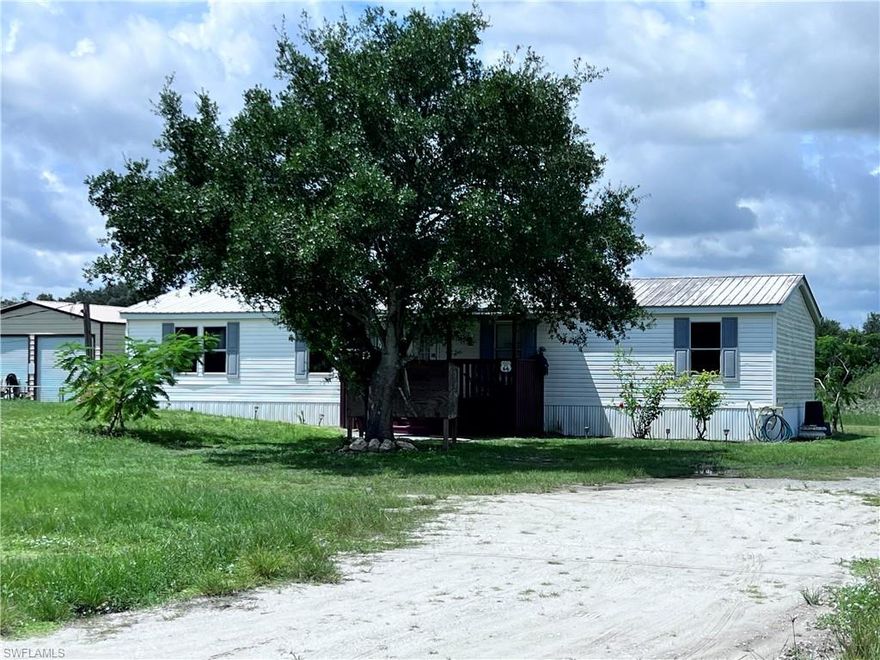 Escape the city and embrace the tranquility of rural life with this charming 3/2 manufactured home located in the heart of LaBelle! Built in 1998, and 1,440 sq. ft. this solid home features a durable metal roof, spacious interior, and sits on half an acre perfect for outdoor enthusiasts, gardeners, or anyone looking for room to spread out.
This home is ideal for those who crave peace, privacy, and plenty of yard space. Whether you're dreaming of raising chickens, planting fruit trees, or simply enjoying the stars at night without city lights this home makes it possible.
