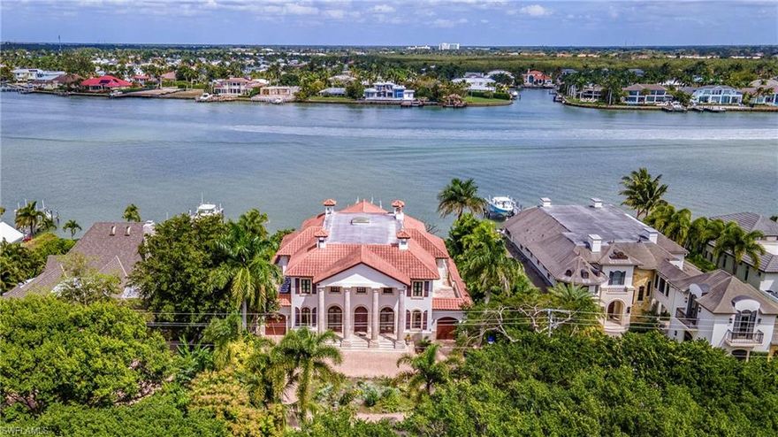 Impeccable Naples Bay views from this authentic Tuscan designed home featuring marble columns and floors throughout. Built in 2001 this home has been beautifully maintained yet is perfect for updating or remodel. Just a few features include home theatre, large formal dining room, wood lined library/study, large master suite with custom designed walk-in closet, oversized lot and much more!