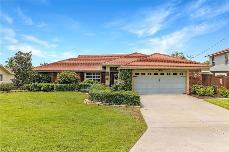 Welcome to your own piece of paradise! This turnkey home features an open, spacious floor plan with 3 bedrooms, pus den, 2 baths,10,000lbs boat lift, sailboat access, NO BRIDGES! Cathedral ceilings, LVP wood plank throughout, and a Gerard roofing system (50 yr transferable, Class 4-120 mph warranty). The kitchen has all new appliances, 2 tone solid wood cabinetry, granite countertops/island. Beautiful master suite with access to the lanai/pool area, large master bath & walk-in closet.  Bedrooms 2 and 3 are very spacious with walk-in closets.  The pool/lanai area is very private and features a beautiful summer kitchen with Jenn-Aire grill rotisserie, side gas burner, and refrigerator. The lanai has accordion shutters across the entire back. The pool/spa has been completely updated with a fully wireless automation system, new pool heater & pumps.  The backyard is the perfect retreat featuring Pergola with a swing, a firepit area waterside with wood planked seating and stone columns, and a stone terraced backyard.  Garage has a split AC unit, tankless hot water heater, desk area, and wall to wall cabinets for plenty of storage. Teds Shed included.