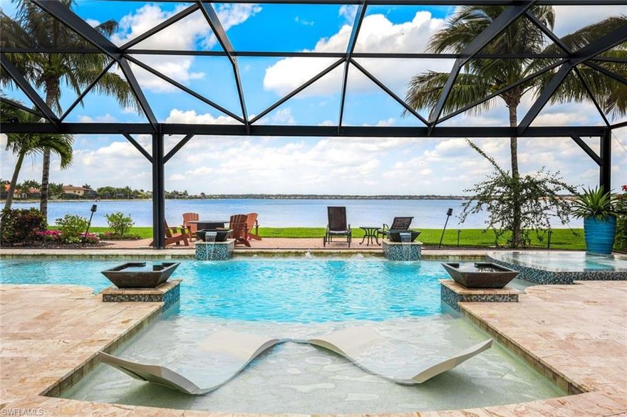 ENJOY BREATHTAKING VIEWS FROM THIS RARE LAKEFRONT PROPERTY WITH A PRIVATE BEACH IN THE QUARRY! DEEDED BOAT DOCK INCLUDED TOO! OPTIONAL GOLF MEMBERSHIP AVAILABLE TO PURCHASE (AVOID WAITLIST) 
This elegant luxury home features 4 bedrooms, 3 baths, a 3 car garage and is located in the exclusive South Shore Estates within walking distance to the Quarry Beach Club and the Quarry Golf Club.  Enjoy PANORAMIC views from your expansive lanai featuring a custom outdoor kitchen, travertine deck, picture windows, a gorgeous saltwater pool complete with a sun deck, spa, water features, Nebula lighting, and an outdoor paver deck with a fire pit. Fine Appointments/Special Features include new upgraded white kitchen cabinets, farmers sink, quartz countertops and an extended island, marble custom backsplash, upgraded custom light fixtures throughout, marble walls in front foyer,  custom wood working throughout, stone work around all outdoor windows, custom wrought iron front door, solid wood doors, crown molding, plantation shutters, impact windows, storm smart shutters on the lanai,New AC (2023) plus more!  A "must see" to appreciate the finishing touches!  The Quarry is a an amenity rich gated lakefront community offering over 500 acres of lakes for boating, water skiing, paddle boarding, jet skiing, kayaking, and fishing.The NEWLY RENOVATED Beach Club includes Tennis, Pickleball, Bocce Ball, a Tiki Bar, Restaurant, Pool-Side food/drink service, a Wellness Center, and a full-time activities director to ensure a good time is had by all. The Golf Lodge & Golf Club offers an 18 hole PGA Level Hurdzan-Frye Golf Course. GOLF (OPTIONAL)