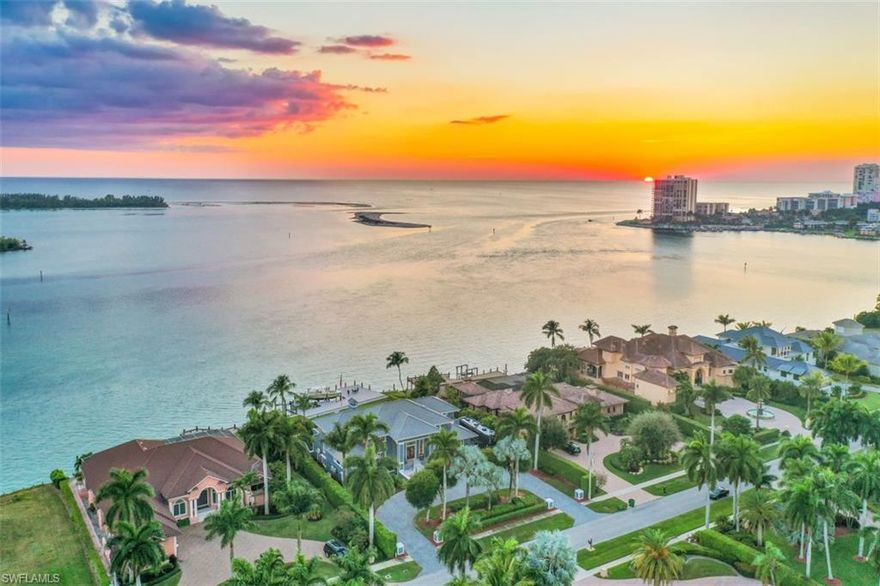 Mediterranean estates section mansion offers Gulf direct access with South facing Caxambas and Gulf of Mexico water views. Enter the circular entry foyer with statuary fountain. Maximizing light, the open plan living room features glass sliders, clerestory windows and upper loft style walkways. A Formal dining room and remodeled dine-in Chef’s kitchen features a gas range, custom cabinetry and breakfast bar. 5 Bedrooms and 5 baths ground level primary, marble bath, home office, 3 suites w/custom baths & private balconies including charming mother-in law suite with kitchenette. Arched doorways, wooden beams, multiple fireplaces, tile floors, graceful wrought iron features, stained glass windows, wet bar, additional den, and automated awnings, screens and impact shutters.
Enjoy the recreation/ billiards room, dedicated workshop, wine cellar with 3 car garage and room for RV parking. 
Enjoy the outdoor living via an expansive tiled lanai, unique pool, outdoor bar & kitchen, living/dining areas leading to an expansive lawn, 128 ft water frontage, new sea wall and dock with 2 boat lifts. Space and taste make this a banner home for a spectacular indoor/outdoor lifestyle.