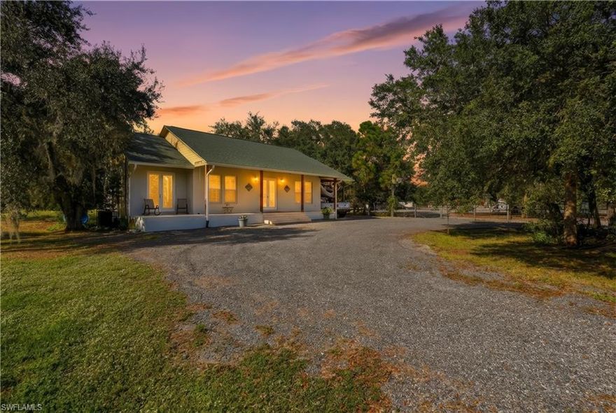 This beauty features a grand total of 2,358 sq ft! With an impressive open layout with 10-foot ceilings that offer a spacious feel throughout. Sitting on over an acre of land this 3 bedroom, 2 bathroom home is a must-see. Multiple ample covered parking spaces to accommodate vehicles, trailers, or recreational equipment. The spacious driveway was designed for easy entry and exit for larger vehicles. Fully fenced for added privacy and security. Entire home equipped with hurricane-impact windows and doors.  Automatic whole-house generator ensures uninterrupted power in case of an outage. Kitchen allows for drinkable tap water with a reverse osmosis filtration system. Carbon and fire alarm. RV hook up is available. Zoning permits horses and other livestock. No HOA restrictions or fees. Centrally located within 1-1.5 hrs from Miami, Naples, Fort Myers, Cape Coral, Fort Lauderdale, West Palm Beach, and Okeechobee.