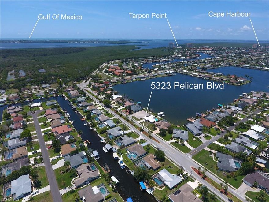 Located on prestigious Pelican Boulevard and just steps from the fountains at Rotary Park, this Stunning Remodeled Open Concept Waterfront Home is a Boater’s Dream ! Minutes to Open Water and on to Sanibel, Captiva and the Gulf of Mexico. Amazing Chef’s Kitchen features Ocean Beige granite countertops, custom soft close cabinets, GE Slate appliances, an elegant Beverage Bar with wine cooler and views of your stunning pool and canal. Bathrooms tastefully appointed with granite vanities featuring double sinks. Travertine natural stone flooring throughout. The outdoor space in this Home is perfect for entertaining highlighted by a large covered lanai with wood plank ceiling, oversized pool with Bahamas inspired iridescent tile and a spacious pool deck. Room for a large Boat and secondary space with covered lift. Plantation shutters, walk in closets, multiple sliders, all new plumbing and the list goes on and on. Welcome to Paradise !