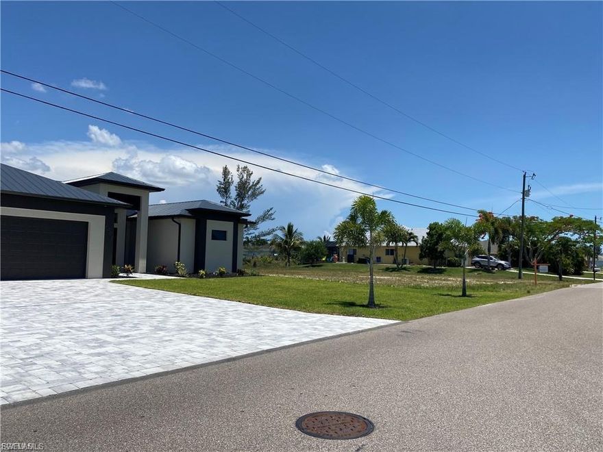 Located in the heart of Cape Coral, this waterfront lot is perfect for your dream home. The property is within walking distance from the Palmetto Pine Country Club and between two main roads, making shopping, dining and fun easily accesible.