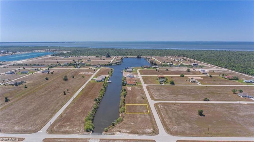 Build your dream home on this Gulf access waterfront lot located on the Eastover Canal. This property offers boating access with only one bridge to the North Spreader Waterway, leading directly to Matlacha Pass and the Gulf of Mexico. A seawall is already in place, saving time and expense. Conveniently located just blocks from the upcoming Crystal Lake Park redevelopment project, adding future value to the area. Quicksilver Canal Bridge