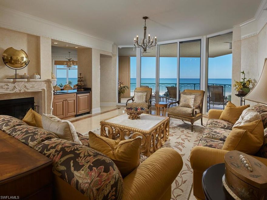 Rarely available Veracruz end residence located within private, gated Cape Marco!  This is the only Veracruz residence available at time of listing.  Luxurious appointments abound from this 4 bedroom, 4 bath residence that has been professionally designed by Foxworthy Interiors and boasts private foyer, fireplaces, extensive millwork, wet bar, and gourmet kitchen featuring custom cabinets, granite counters, and stainless steel appliances.  Enjoy gorgeous views from two lanais.  The larger, front lanai offers outstanding panoramic views of Marco's crescent shaped beach and the Gulf of Mexico.  Enjoy all of the upscale amenities at prestigious Cape Marco including 6 HarTru tennis courts, fitness center, and private beach access in addition to the many amenities Veracruz offers - fitness center, business center, theater, 2 pools, guest suites, social rooms, and more.