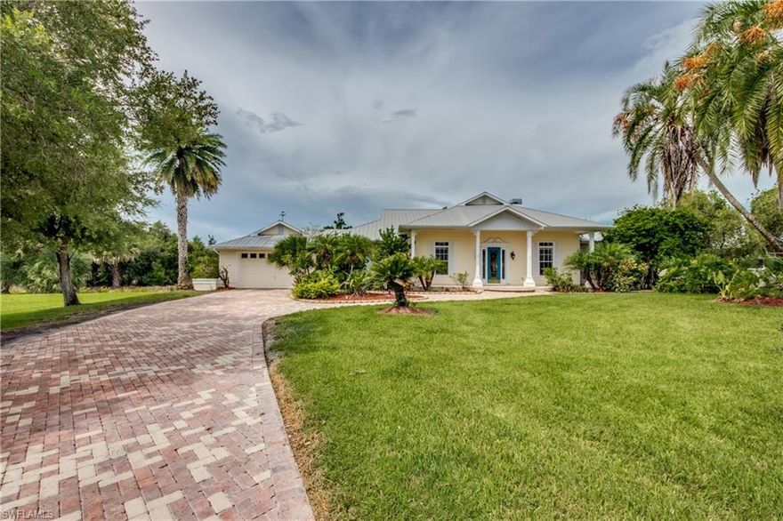 Completely remodeled open concept floor plan ideally situated on 1.01 acre lot on the freshwater side of the Caloosahatchee River in the serene Riverwind Cove Community.  This home offers an inviting entrance with a view to the river and is designed with plantation shutters, marble counter tops in kitchen, Italian tiled wood fireplace, solar heated pool with waterfall, and pavered driveway.  Ten foot ceiling heights throughout with a twelve foot ceiling in the great room.  New luxury vinyl wood-look plank flooring throughout the home, all new cabinets, lighting, every room freshly painted including ceilings.  All new tile in showers, with new fixtures as well.  Shows like a new home.  A lit 100 foot wooden walk way through the nature preserve to the boat dock, which comes equipped with 13000# covered boat lift.  Inside boat slip measures 10 feet by 40 feet.  The dock has 220 and 110 electricity as well as fresh water.