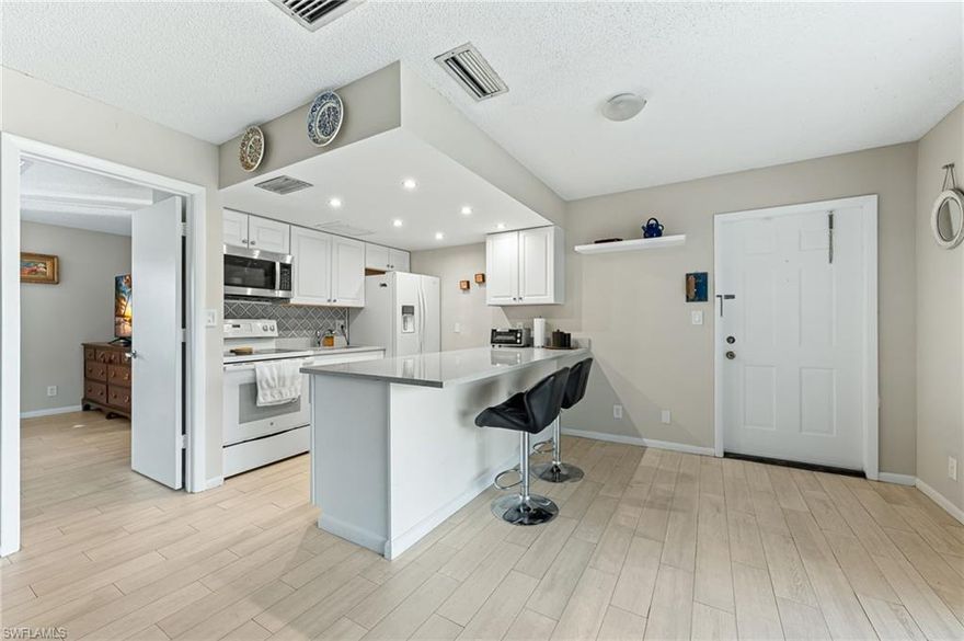 Located just minutes from Naples’ best beaches, this beautifully maintained one-bedroom, one-bathroom condo offers the perfect blend of comfort and convenience. Enjoy serene lake views from your private screened-in patio, creating a peaceful retreat to relax and unwind. Inside, the unit features a cozy kitchen with elegant granite countertops, updated tile flooring, and an abundance of natural light throughout. The spacious primary bedroom provides a comfortable escape, while the renovated shower in the bathroom adds a modern touch. Situated on the upper level, this condo offers added privacy, away from nearby noise and distractions. Major upgrades include a new roof and AC unit, both replaced in 2024. The well-managed community boasts strong financials and experienced no damage from Hurricane Irma, offering added peace of mind. Conveniently located near top local restaurants, vibrant nightlife, and some of Southwest Florida’s finest beaches, this condo is ideal as an investment property, vacation getaway, or full-time residence. This is truly a place you’ll love to call home.