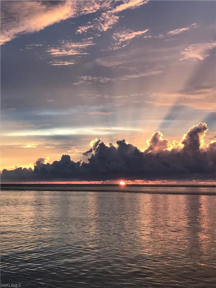 Exceptionally maintained and updated, Cote d'Azur floor plan with expansive Gulf views from the Living Room and the Master Bedroom and Bath. Water as far as you can see, and sunsets are a breathtaking event almost everyday!   Kitchen recently updated with quartz counter-tops, tile back splash, new refrigerator, and new microwave.  Each bedroom has its own En-suite.  Hurricane Impact windows and doors throughout.  La Peninsula is a Gated community with lushly landscaped grounds, and a clubhouse w/pool & spa, fitness room, and tennis courts!  Kayak rack for owners in the garage, and climate controlled storage space for each unit. Maintenance fee includes Master Association and Building Association.  Seawall Assessment paid in full.