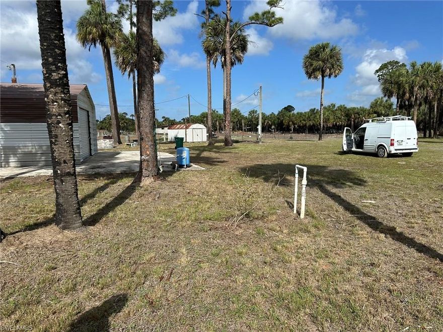 A picturesque property with considerable potential is situated in a secluded neighborhood, boasting canal-front views. The land is equipped with a well, partial septic system, and existing garage setup, as well as a small storage shed. Additionally, the lot has an established power connection and is fully cleared, meeting county requirements for construction of a home or installation of a manufactured dwelling. This serene and peaceful setting is ideal for individuals seeking a tranquil retreat from urban life.