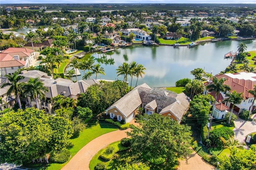 Bring your plans and build your custom home on this exceptional site with wide water views overlooking Hidden Bay. Surrounded by luxury properties, this location offers a premier site with direct water access to the Gulf of Mexico. Enjoy the favorable resort amenities of the Port Royal Beach Club and close proximity to the downtown area of Old Naples.