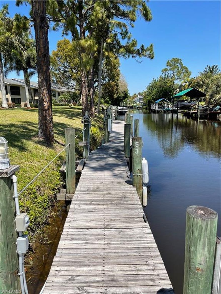 Gulf access condo with boat dockage at no extra charge. Minutes to the river. Tastefully furnished-comes turn key. Pet friendly!!  Desirable second floor end unit with southern exposure in Yachtsman Cove @ Riverbend. Cathedral ceiling in great room with a new tropical ceiling fan. Spacious two bedrooms with an on suite master bath. Large kitchen with plenty of cabinets and counter space. Washer and dryer enclosed in kitchen(see pics). Corner lanai is spacious and has a storage closet. Large covered parking space with your own outdoor storage unit. Community pool recently renovated. Exterior of buildings painted in 2019 and new roof approx 8 years old. Enjoy having your boat in your backyard canal (water and electric available). Pride of ownership shows thru-out and with all the furnishings staying, all you need are your suitcases! A must see!! Minutes to Downtown Fort Myers River District as well as I-75. Call today to schedule your appt