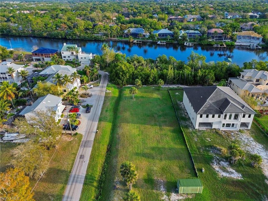 Build your dream waterfront home on this exceptional 1.12-acre riverfront property ideally located in beautiful Bonita Springs. This cleared and ready-to-build homesite offers a rare opportunity to create a private retreat while enjoying the natural beauty and tranquility of riverfront living. With generous acreage and direct water frontage, the property provides ample space for a custom residence, outdoor living areas, and the waterfront lifestyle so many buyers seek. Plans are available for a boat dock, making it easy to envision launching your boat right from your backyard and enjoying convenient access to the open waters of the Gulf. Spend your days boating, fishing, kayaking, or simply relaxing while taking in the peaceful water views. Ideally situated just minutes from the pristine sandy shores of the area’s renowned beaches, including Bonita Beach and Barefoot Beach Preserve, this property offers the perfect blend of privacy and coastal convenience. Opportunities like this—an oversized, cleared riverfront lot in such a desirable location—are increasingly rare. Bring your vision, your builder, and your plans to create the waterfront home you have always imagined.