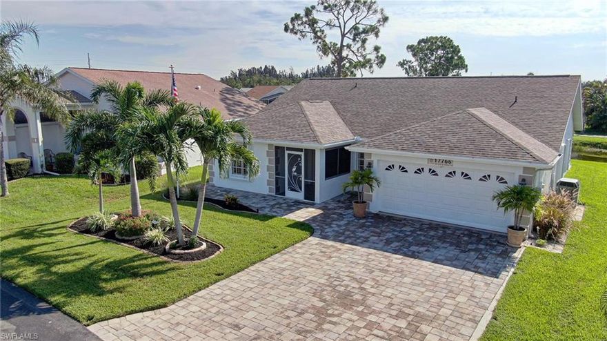 WATERFRONT & GOLF VIEW! This beautifully remodeled home in the 55+ gated community of Sabal Springs is a must-see! Featuring 2 oversized bedrooms, 2 updated bathrooms, and a flexible four-season room perfect for guests, hobbies, or a home office. Enjoy stunning views of the lake, wildlife, and golf course. UPGRADES & HIGHLIGHTS: Hurricane-tested: No damage during Hurricanes Ian or Milton. Tile floors throughout, laid on the diagonal. New hybrid heat pump water heater. Paver driveway, walkway, and patios around the home.  No flooding in driveway during rainy season. Sunset-facing front, keeping the back lanai cool in the evenings. Incredible wildlife views eagles, osprey, herons, ducks, turtles, and more. Golf course view without golf cart traffic or intrusion. INTERIOR FEATURES: New kitchen with dovetail solid wood drawers, granite countertops, and new cabinets. Two remodeled baths with dual granite counter tops. New hurricane-rated sliders on lanai. New refrigerator, washer, and dryer. New side garage door and plantation shutters throughout. Hot tub (110V) included and ready to enjoy.  EXTERIOR/COMMUNITY: 2015: Full re-pipe, new double front doors. Drought-tolerant landscaping. Low HOA fees include: exterior house painting every 7 years, irrigation, mowing, fertilizer, cable & high-speed fiber internet, 24 hour manned gatehouse. No CDD and no flood insurance required. Discounted golf memberships with no increases in the last 7 years. Upcoming upgrades: New tennis/pickle-ball courts and resurfaced pool deck by July 2025. On-site restaurant with live entertainment. Close quickly and move right in to this home!