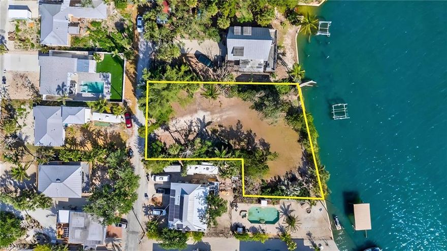 This OVERSIZED Waterfront LOT offers DIRECT GULF ACCESS on the prestigious Estero Bay Aquatic Preserve. 11,230 SQ FT with 123 FT of Bay Frontage and 165 FT Depth is an idyllic Location to BUILD NEW ELEVATED 2 STORY OR 3 STORY BAY FRONT HOME. A perfect setting to watch the dolphins and manatees play from your very own dock. PARADISE AWAITS!! BIG BOATERS BAYFRONT DREAM! Get lost in your own SUNSHINE DAYDREAM with sweeping BAY views and 165 feet of seawall, this remarkable lot presents the perfect opportunity to build your dream home. Located on a quiet and private areas of Estero Island. Just a short stroll to the Publix grocery store and the Marina. This ONE-OF-A-KIND LOT offers the opportunity to create your own coastal living MASTERPIECE. With boundless potential at your fingertips, you have the freedom to design a residence perfectly tailored to your unique lifestyle and preferences. Let your imagination run wild as you envision luxurious living spaces, expansive outdoor entertainment areas, and every amenity imaginable. Seize this opportunity to turn your dreams into reality and make your mark on this unparalleled waterfront canvas! Don't miss this opportunity to elevate your waterfront lifestyle to new heights! Come be a part of the Fort Myers Beach Renaissance. Onsite multiple builder introductions are available.