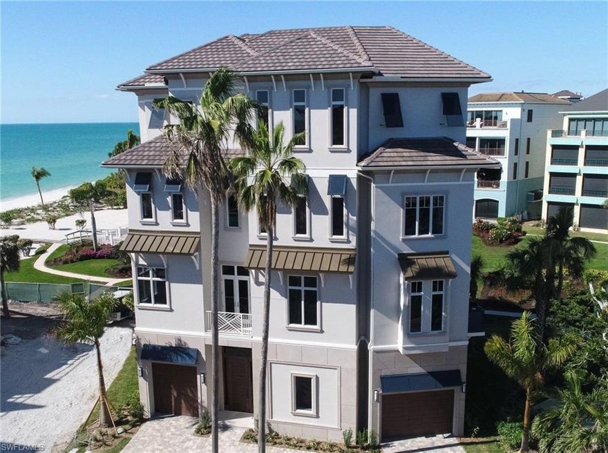 New construction now complete on this magnificent Barefoot Beach home.  Situated on a lot and a third, only the finest amenities & features can be found including solid concrete construction, hurricane impact windows & doors, electric shutters & screens, voluminous ceiling heights, whole house generator, and private elevator to all floors. The main level features an open great room with lanai that is perfect for entertaining featuring outdoor fireplace and kitchen, "her office," and a gourmet kitchen that boasts the highest quality appliances including a 60" Viking range, Subzero refrigerator and freezer, and large walk-in pantry.  Third floor includes the spacious master suite with private deck, soaking tub, large walk-in shower, separate laundry, "his" office and a private guest suite. Fourth floor features cloud room with full bath, wet bar and lanai offering stunning Gulf views, and two guest suites.  This home also includes state of the art electronics & security system. Barefoot Beach Gulf home amenities include clubhouse with fitness, gathering room, pickelball court, and 2 Har-Tru tennis courts. Optional beach club membership available. Ask Broker for details.