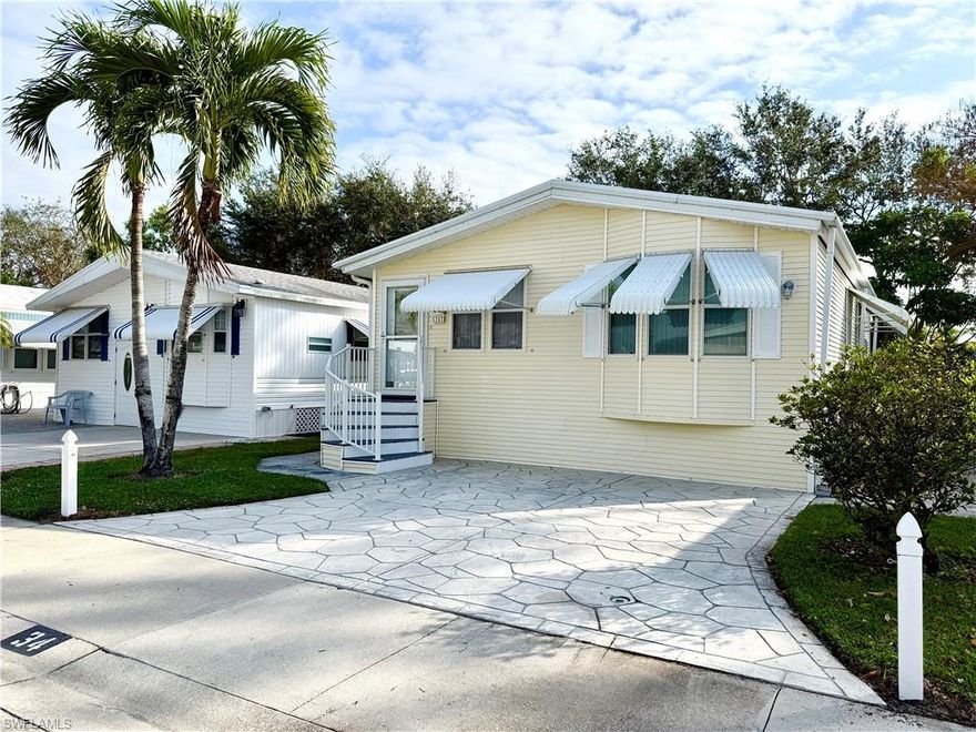 BEAUTIFUL & OUTSTANDING CONDITION! All you need to do is move into this furnished 2Br/1.5Ba home! Thank you for viewing 34 Bass Lane in the Imperial Wilderness Condominium Association of Naples, FL. IWCA is a gated 55+ community where YOU OWN THE LAND. The community was never flooded or adversely affected by any recent hurricanes. This charming home offers vaulted ceilings and an extremely spacious front gathering area that includes the living room, kitchen, and dining area. Throughout the home, the decor and color scheme provide a relaxing and pleasing vibe. In October of 2023 luxury vinyl, scratch resistant, flooring was placed throughout the entire residence. Within the last 8 years all of the following updates have occurred: roof, A/C, refrigerator, dishwasher, garbage disposal, toilet, back porch windows, front door & storm door, washer & dryer, back landing & steps, outdoor lights, and front porch & steps. This home is extremely clean and displays true pride of ownership. Outside you will appreciate a lovely grassy view with access to the Nature Trail. Additionally, there is a rear paver patio; both sides of the unit have well-manicured landscaping. On top of all of these tremendous features, IWCA is brilliantly located. It is approximately 3 miles to shopping and restaurants, 11 miles to the Naples beaches, and 8 miles to the Marco Island beaches. Airport access is also easily attainable— a 45-minute drive (RSW). Maximizing the opportunity to affordably own property in Naples, FL, the HOA fee of $898. per quarter is exceptionally reasonable. That fee covers many of your needs: the safety of a gated community, water, sewer, lawn care, basic cable, trash, recycling, and community amenities. Community amenities include 2 pools with spas, bocce, pickleball, pétanque, tennis, shuffleboard, billiards, ping pong, a library, clubhouse, 2 dog parks (1 pet, 40lb. max.), nature trail, an extremely active events calendar, and an overall positive vibe!