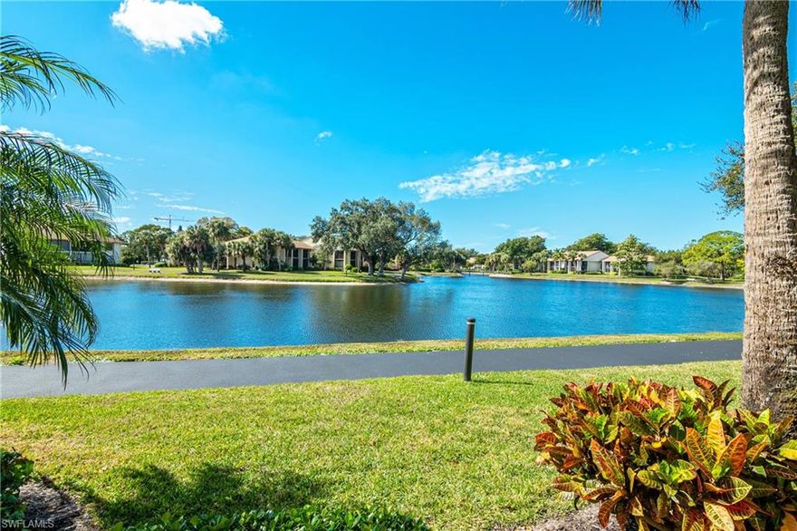 Florida easy living at its best. This waterfront condo is located in a North Naples gated community west of US-41. Close to gulf beaches with easy access to shopping dining and all Naples attractions. This bright and sunny ground floor end unit two-bedroom condo has light coming in from all sides. Your screened Lania overlooks a beautiful lake and estuary providing a continuous show of Florida's waterfowl. The second bedroom/office has its own outdoor private seating area.  A roomy courtyard connects the condo to your garage and offers a great private sitting area for phone calls and conversations away from the crowd. Just outside your back door a lighted 5-mile pathway with bridges winds around the lakes within Retreat & Bently Village for evening strolls and has benches where you can sit and enjoy the sunsets. The community pool is just a short walk away and acts as a social center with Friday night Happy Hour. Here it is easy to slide away and relax in a Florida paradise.