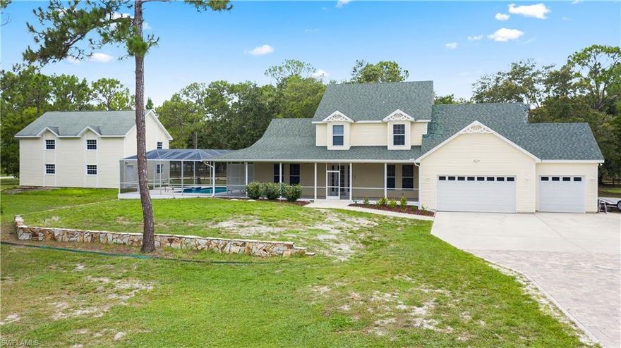 Come on out and see your next beautiful 2 story home on 2.44 acres in Las Lomas!  This hidden area of Cape Coral is your next destination to call home. This maticulously maintained home offers a pool with spa, open and spacious rooms, 3 large bedrooms plus den, 2.5 bathrooms, oversized 3 car garage, crown moldings, wood and tile floors, built in wood shelving and cabinetry in the great room, fireplace, plus high ceilings throughout. The separate carriage house features more space for all your storage needs including room for your RV and or boat.  The overall size of the carriage house is 25x40 with a 14 ft garage door.  There are two upper floors built for storage. The home and carriage house are all concrete block construction with vinyl siding. Don't miss out on this opportunity to own some acreage, horses allowed!